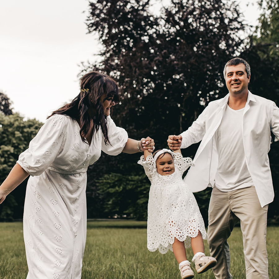 Excited family showing their Disney Park Hopper Tickets