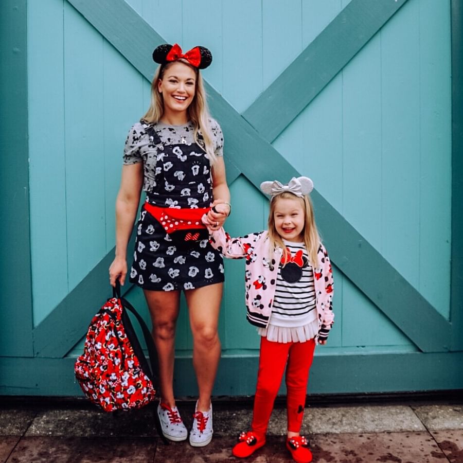 Excited children dressed in Disney-themed outfits ready for Disney World